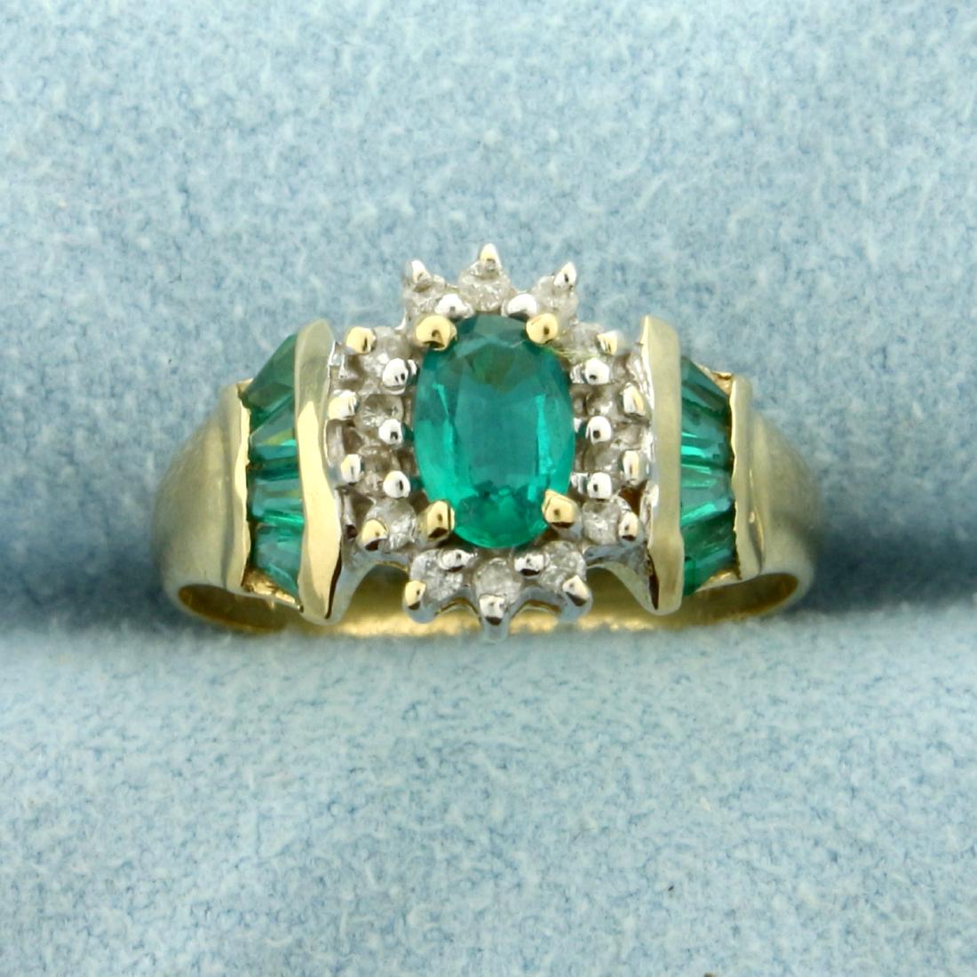 Tsavorite Garnet and Diamond Starburst Ring in 10K: In 10K Yellow Gold. Contains a high quality 6x4mm oval and eight baguette Tsavorite Garnet gemstones with vibrant green color and excellent clarity. It is surrounded by fourteen high quality 1/2pt rou