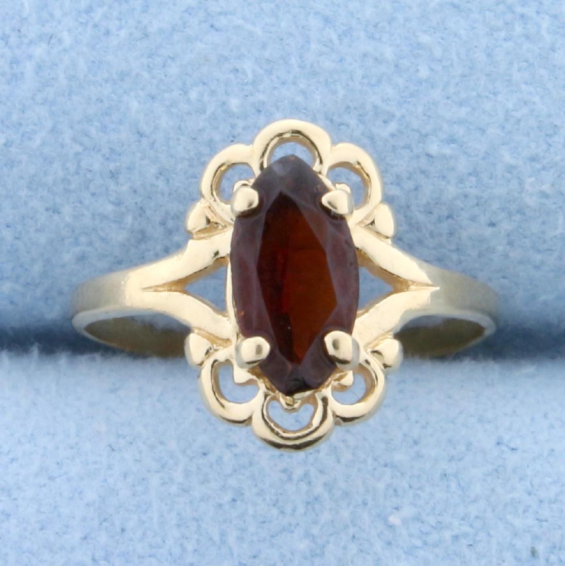 Child's Garnet Ring in 14K Yellow Gold: In 14K Yellow Gold. Contains a high quality natural 8x4mm marquise shaped Garnet gemstone with deep color and excellent clarity. Size 2. 1.1g