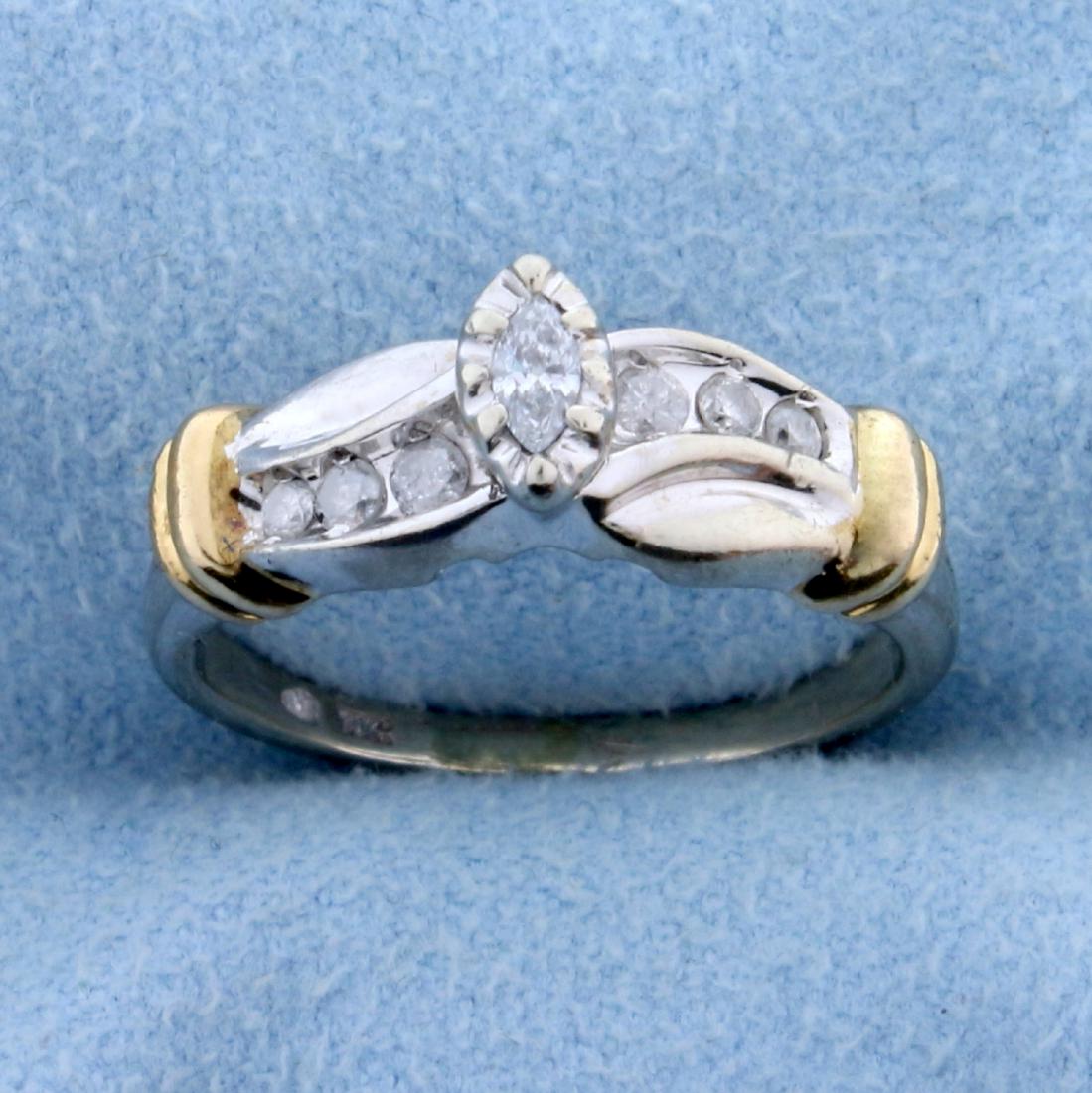 1/5 ct TW Diamond Engagement Ring in 10k White and: In 10k white and yellow gold. Contains .2 ct TW of high quality marquise and round brilliant diamonds - SI to I clarity/I color. Says "Forever" inside shank. Size 5. 3.2g