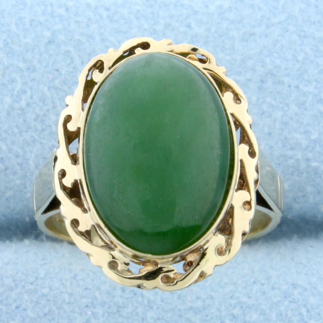 6ct Jade Solitaire Ring in 14K Yellow Gold: In 14K Yellow Gold. Contains a high quality natural 14 x 10mm oval Jade gemstone with uniform deep forest green color and excellent clarity. Size 5. 3.8g.