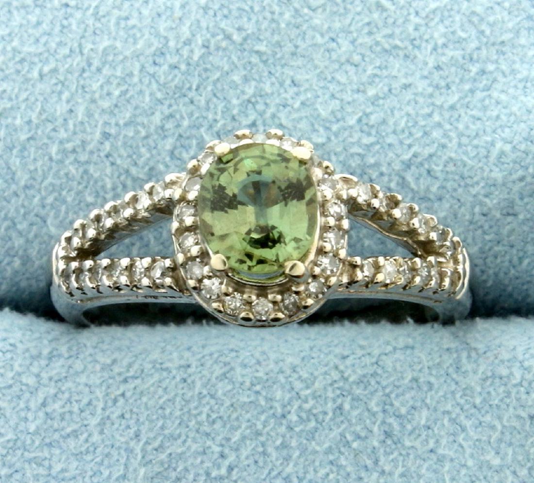 1ct Peridot and Diamond Ring in White Gold: In 10k white gold. Contains a natural high quality 7x5mm oval peridot gemstone with bright green color and excellent clarity. Also contains forty two high quality 1/2pt diamonds. Size 8. 3.5g.
