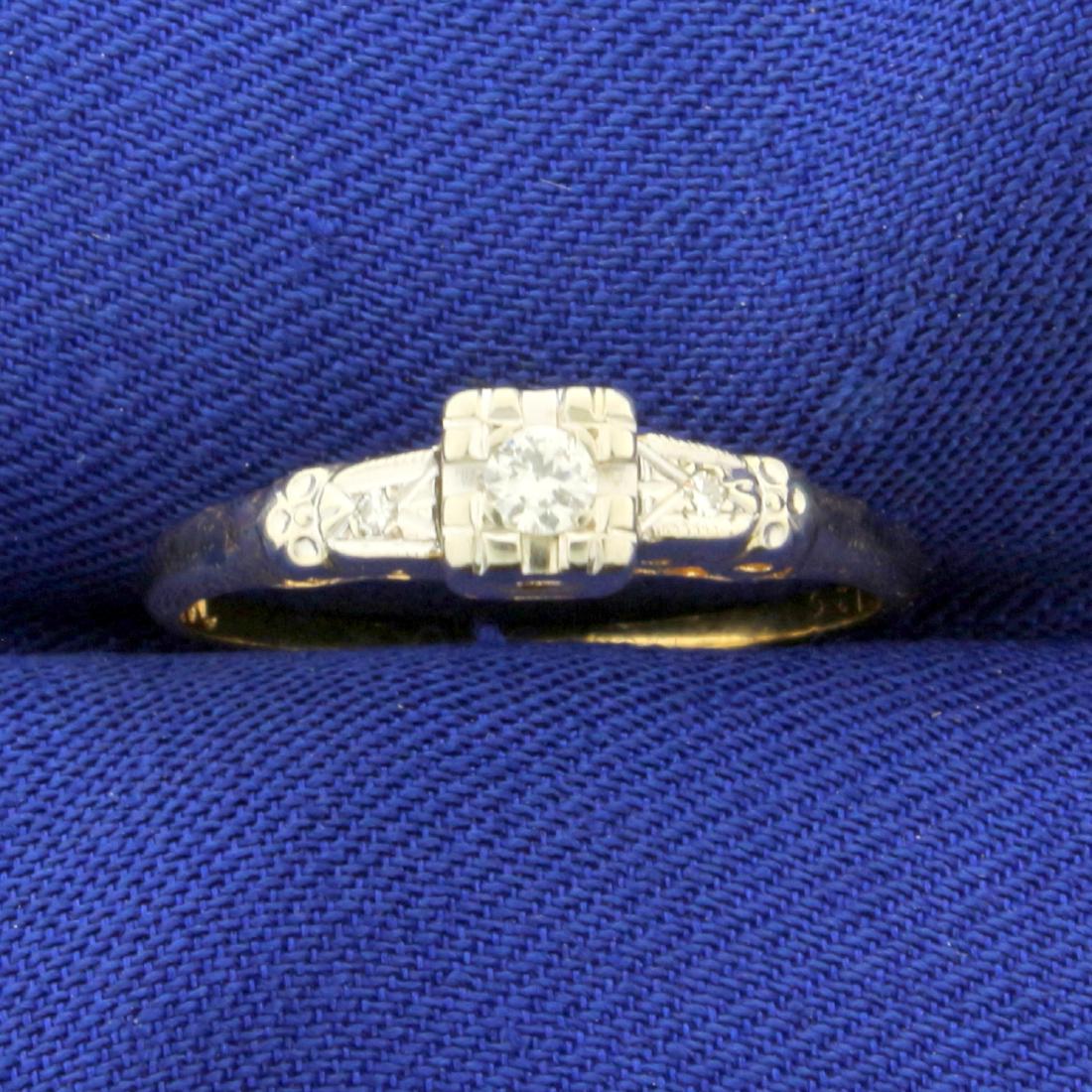 Vintage Diamond Ring in 14K Yellow and White Gold: In 14K Yellow and White Gold. Contains a high quality round .05ct Diamond and two 1/2pt Diamonds, all VS clarity/H color. Size 6 1/4. 1.5g