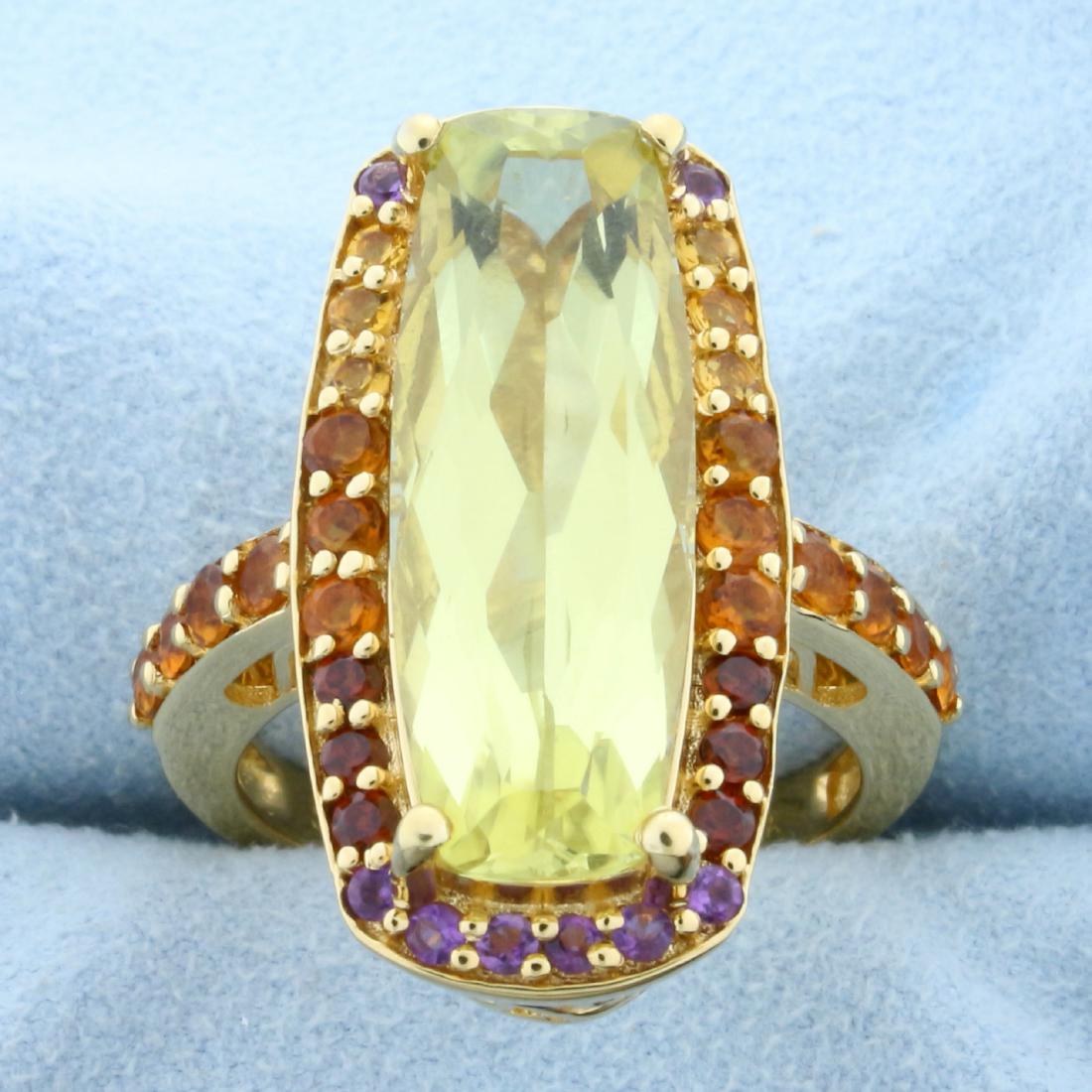 12ct TW Citrine, Amethyst, and Garnet Statement Ring in: In Gold Plated Sterling Silver. Contains a natural high quality 25 x 9mm fancy cut Yellow Citrine with bright yellow color and excellent clarity. It is surrounded by 2cts of high quality Amethyst, Cit
