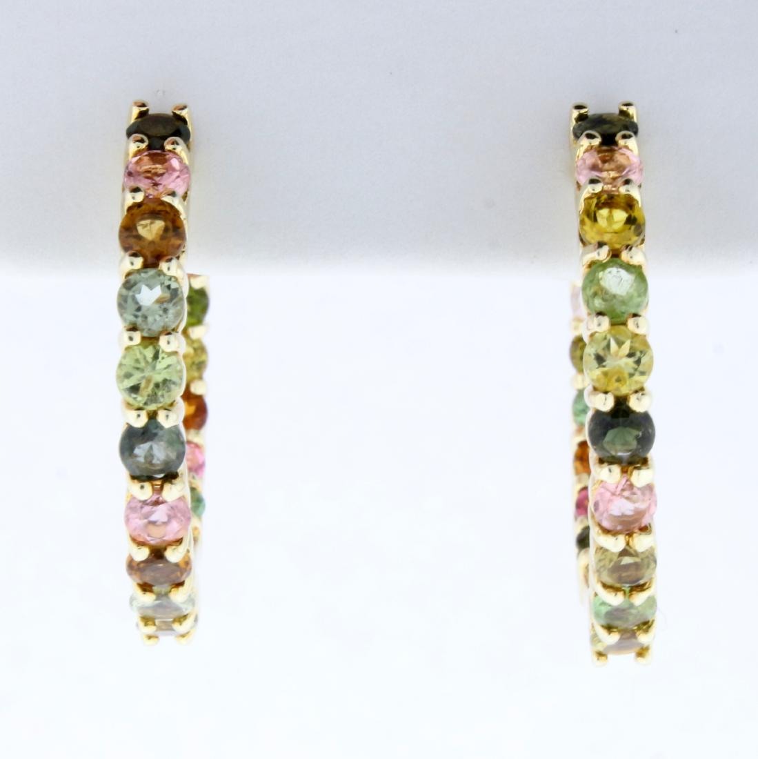 Multi Colored Gemstone Hoop Earrings in Gold Plated: In Gold Plated Sterling Silver. 1 inch diameter. Each earring contains 17 high quality natural 3mm gemstones including Citrine, Peridot, Topaz, and Garnet. All with bright color and excellent clarity.