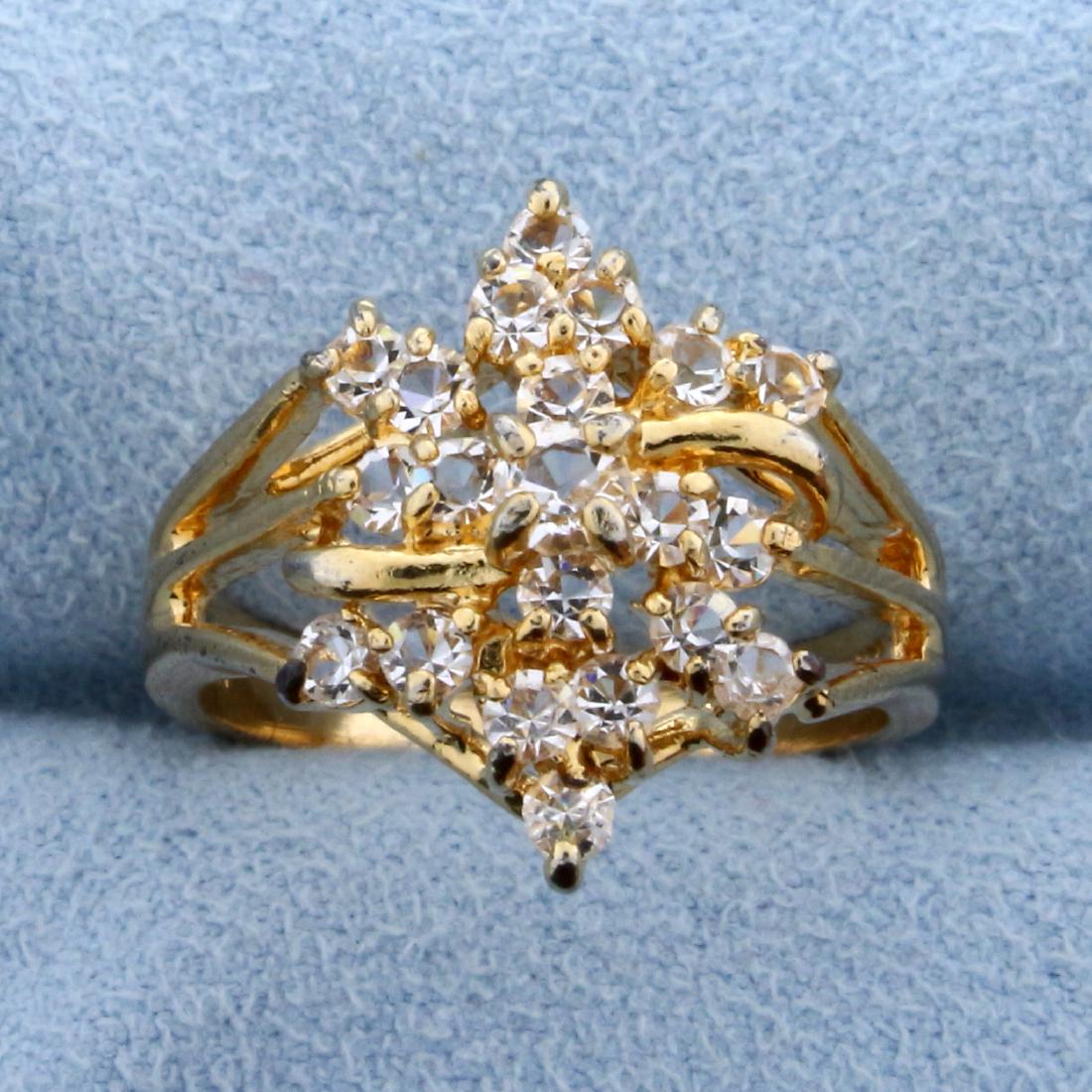 3/4 ct TW CZ Ring in 14k Yellow Gold: In 14k yellow gold. Center CZ is .1ct surrounded by twenty .03ct to .04ct gemstones. CZs have tons of sparkle! Size 6 1/2. 3.5g.