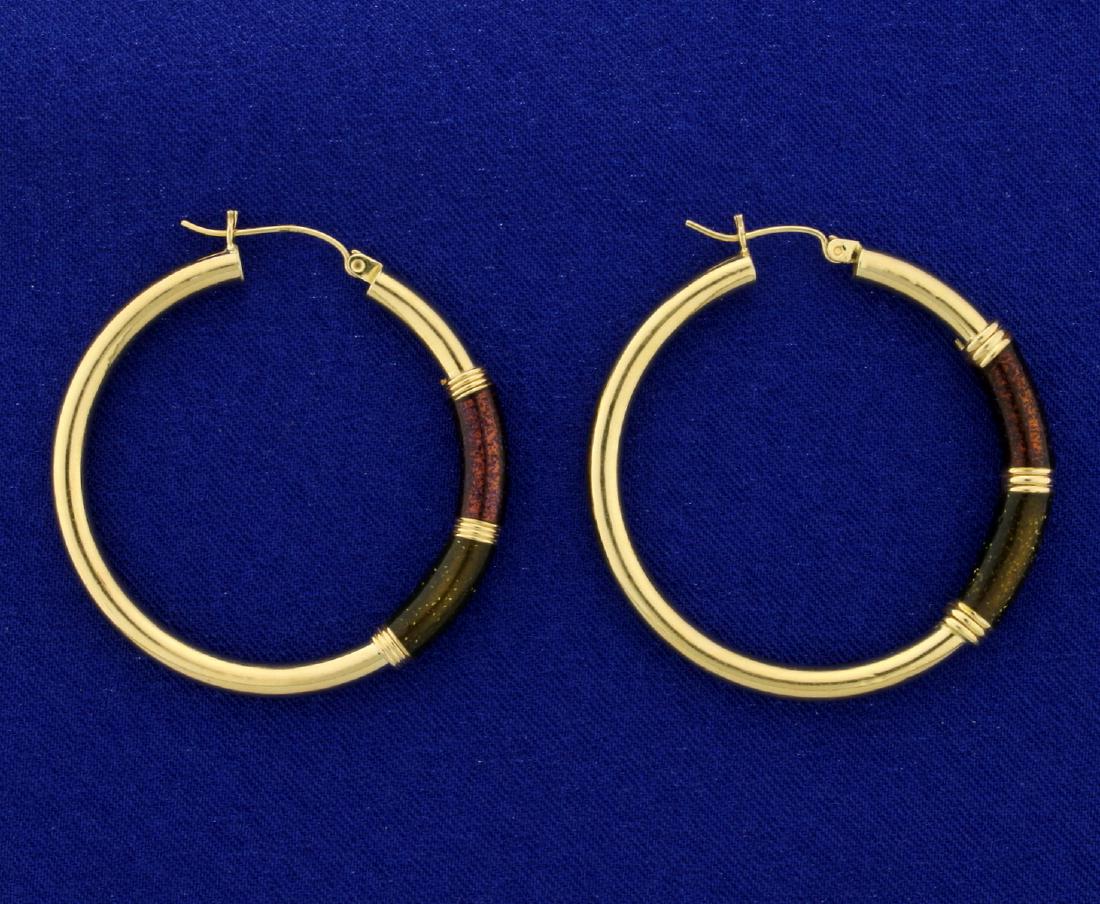 Large 14k Gold Hoop Earrings: In 14k yellow gold. 1 5/8" in diameter. Some minor scratches/dents which does not take away from beauty of these unique earrings. With unique specially applied colored gold dust detail. 4.8g.