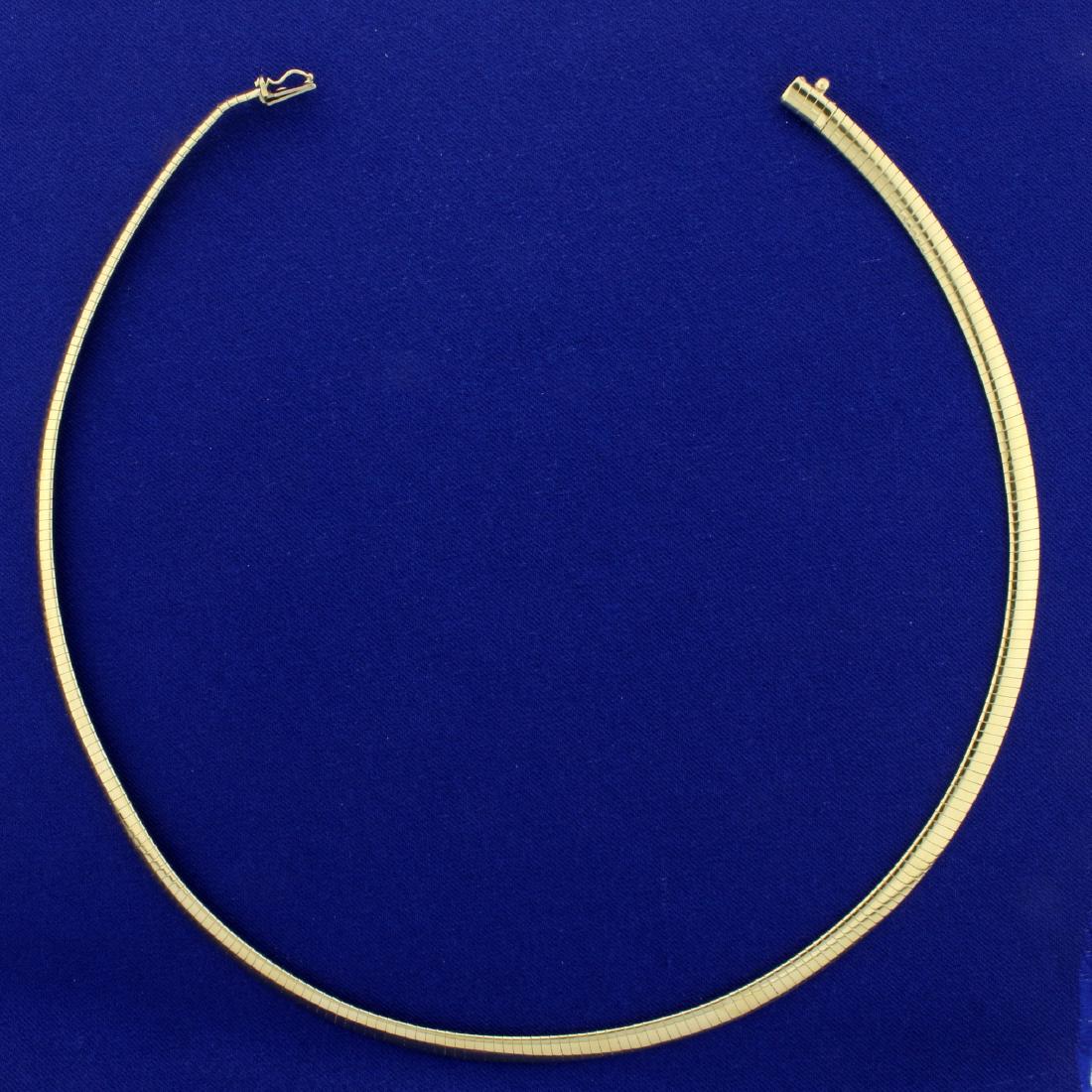 17 Inch Omega Necklace in 14K Yellow Gold: In 14K Yellow Gold. 17 inches long and 5.1mm wide. 21.4g