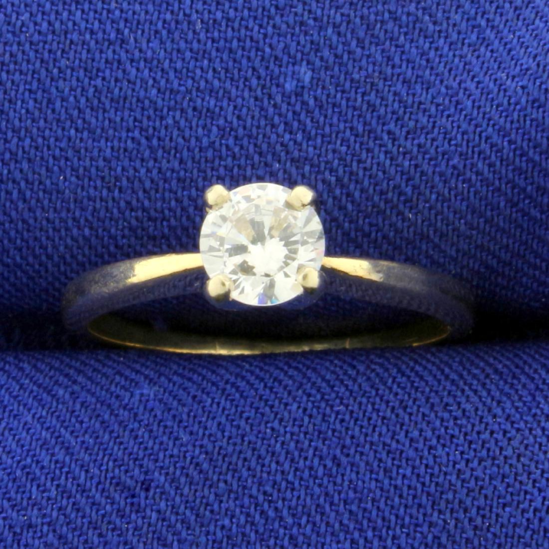 1/2ct Solitaire CZ Engagement Ring in 14K Yellow Gold: In 14K Yellow Gold. Contains a high quality 1/2ct round CZ gemstone with lots of sparkle. Size 5. 1.8g