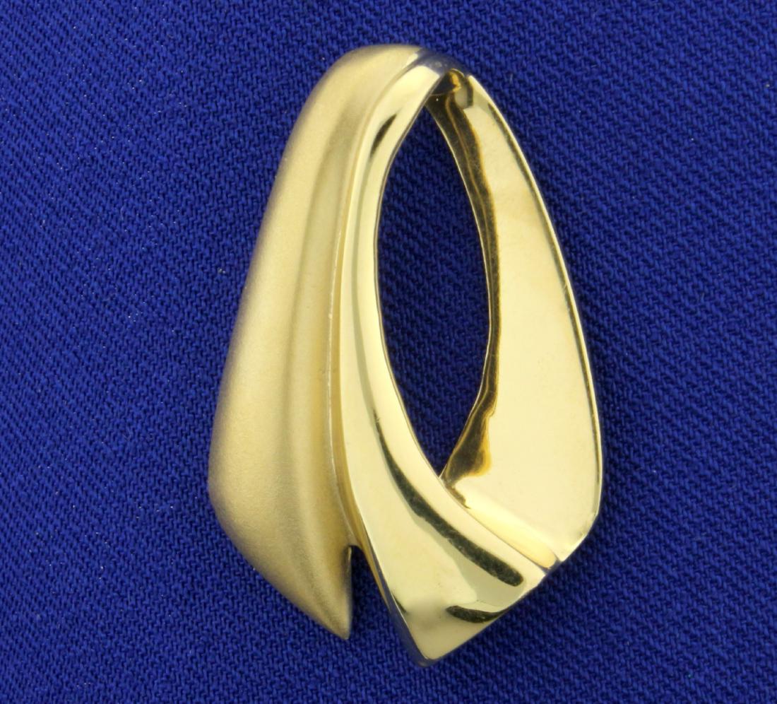 Unique Slide or Pendant in 14K Yellow Gold: In 14K Yellow Gold. Matte finish on half, high shine on other half. 1 1/4" long. 6.7g