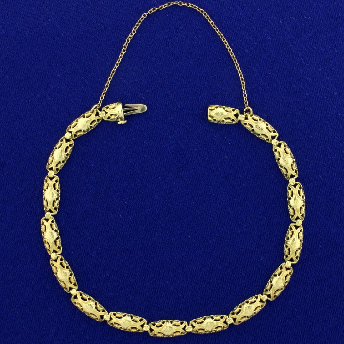 Vintage 7 Inch Designer Link Bracelet in 14K Yellow: In 14K Yellow Gold. 7 inches long, with safety chain and clasp. 6.4g