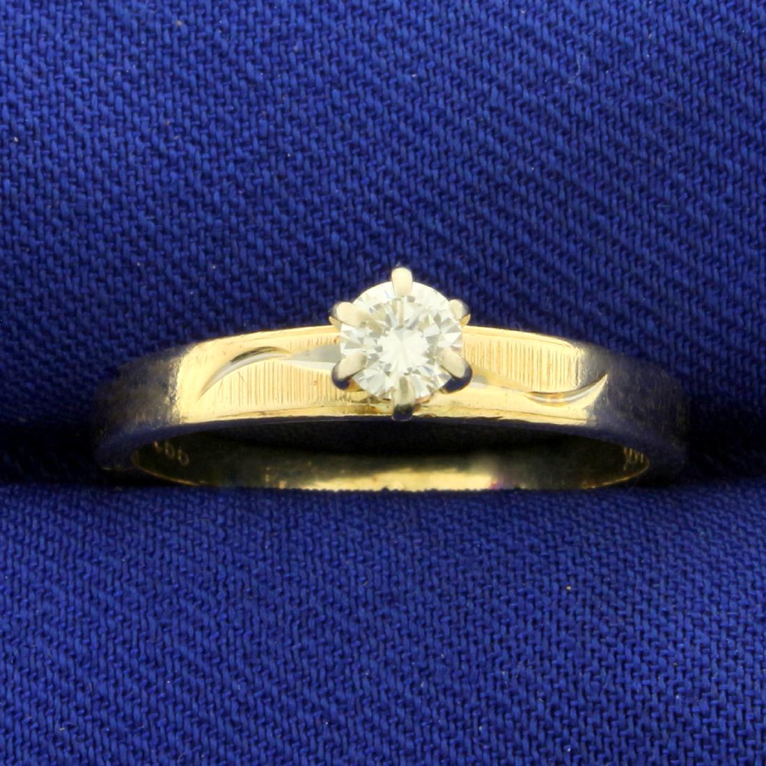 1/5ct Solitaire Diamond Engagement Ring in 14K Yellow: In 14K Yellow Gold. Contains a round brilliant .2ct Diamond, VS clarity/I color with lots of sparkle and brilliance. Size 7 1/2. 2.5g