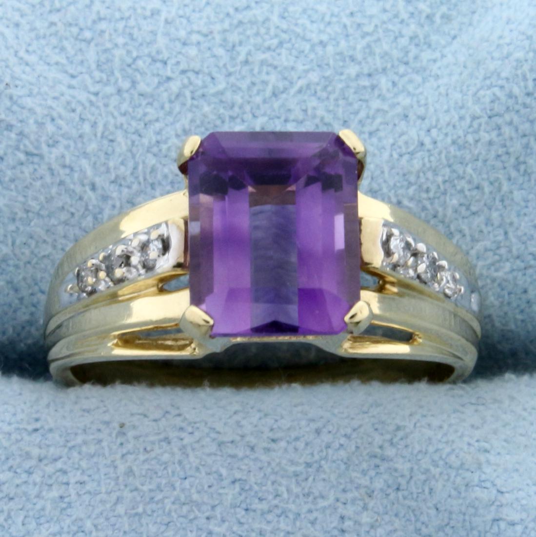 2.5ct Amethyst and Diamond Ring in 10K Yellow Gold: In 10K Yellow Gold. Contains a high quality natural 9 x 7mm emerald cut amethyst gemstone with bright purple color and excellent clarity. Also contains six high quality 1/2pt round diamonds. Size 7 1/