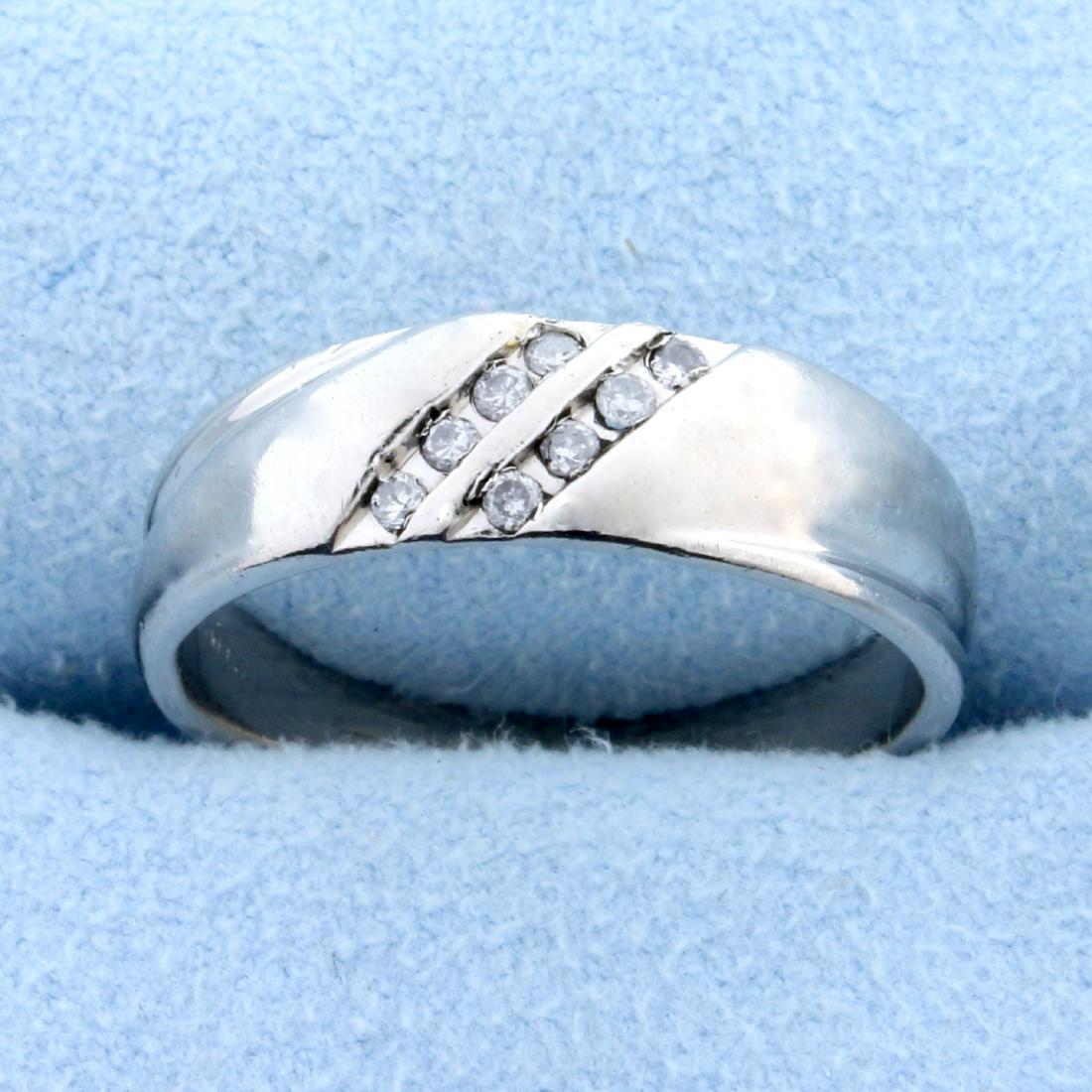 Diamond Wedding Band Ring in Platinum: In Platinum. 6.5mm wide. Contains 8 high quality brilliant diamonds, 0.12 carats TW, set in two diagonal rows, I color/I clarity. 7.7g Size 9