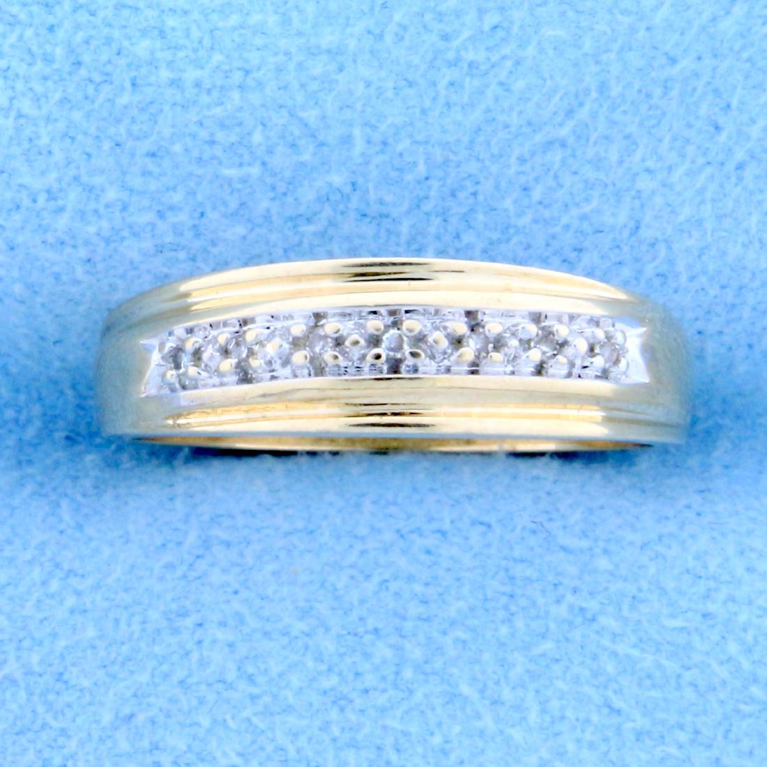 Diamond Wedding Band Ring in 10K Yellow Gold: In 10K Yellow Gold. Contains seven high quality 1/2pt Diamonds. Size 7 1/4. 2.4g
