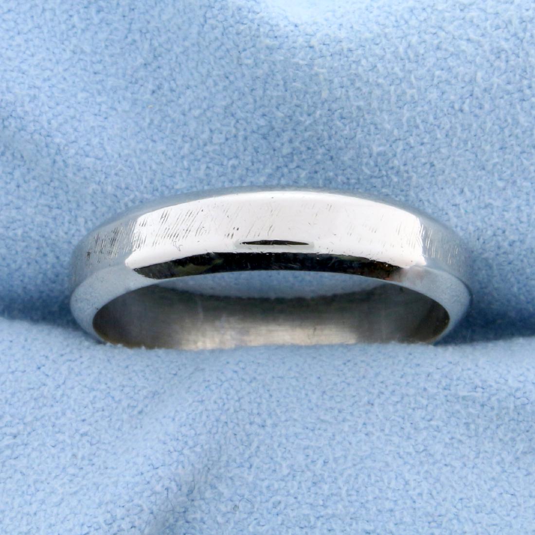 Men's White Gold Wedding Band Ring in 14k White Gold: In 14k white gold. It has faint diagonal tool marks all around band to give a very unique design. 4.75mm wide. Size 10. 4.9g.