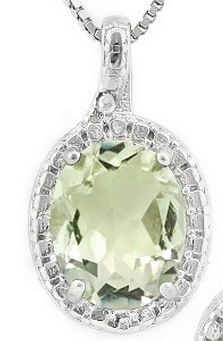 Green Amethyst and Diamond Necklace in Sterling Silver: Contains 1-7x9mm oval cut Green Amethyst gemstone with excellent clarity and green tea color accented with .01ctw genuine diamonds. Measures 5/8" long, set in .925 sterling silver with friction backs.
