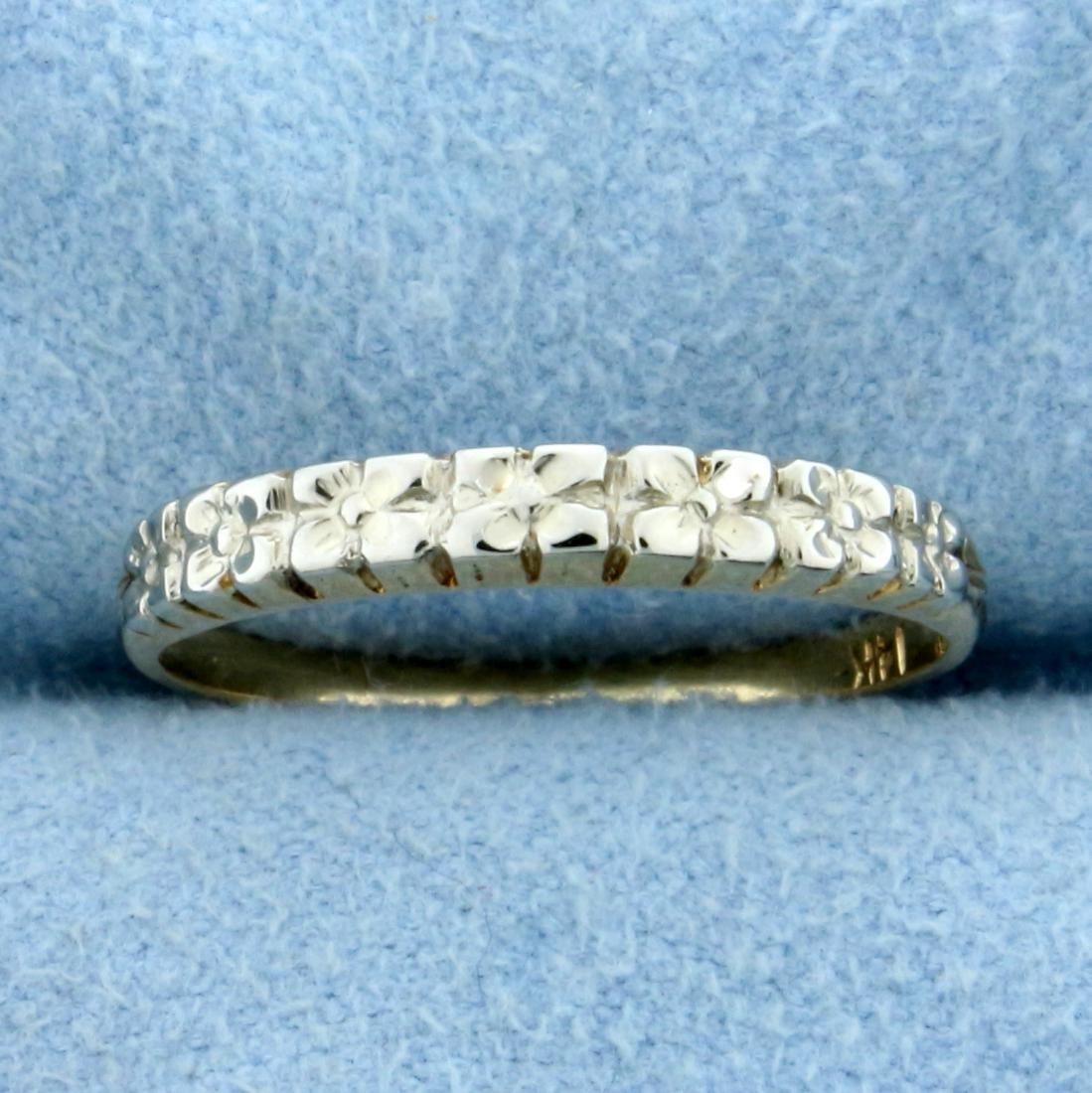 Illusion Stacking Band Ring in 14K Yellow and White: In 14K Yellow and White Gold. 2.7mm wide. White gold design give an illusion of Diamonds in prongs. 2.7mm wide. Size 5 1/2. 1.3g.