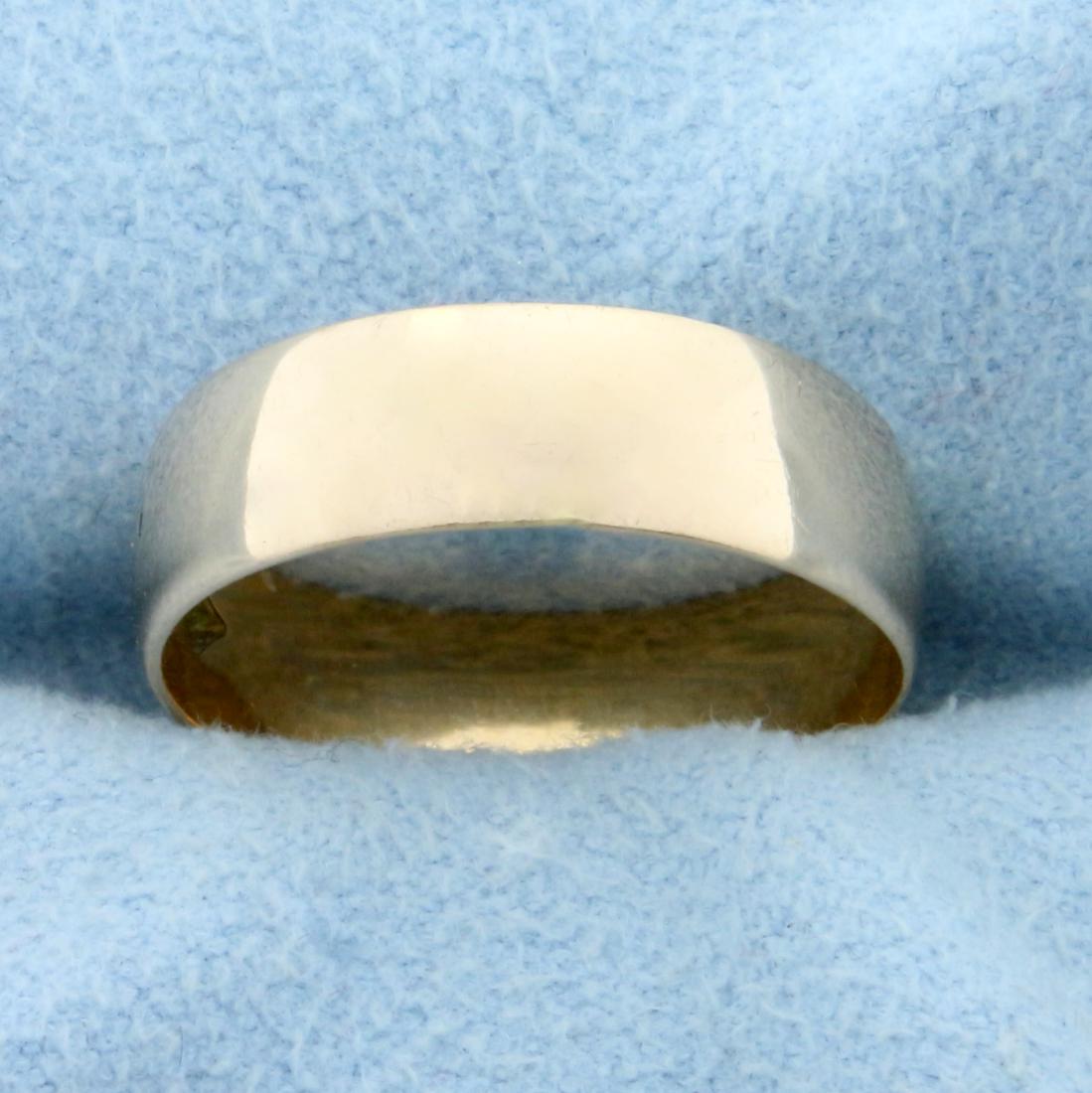 Wedding Band Ring in 18K Rose Gold: In 18K Rose Gold. High polish finish. 5.25mm wide. Size 5 3/4. 2.4g.