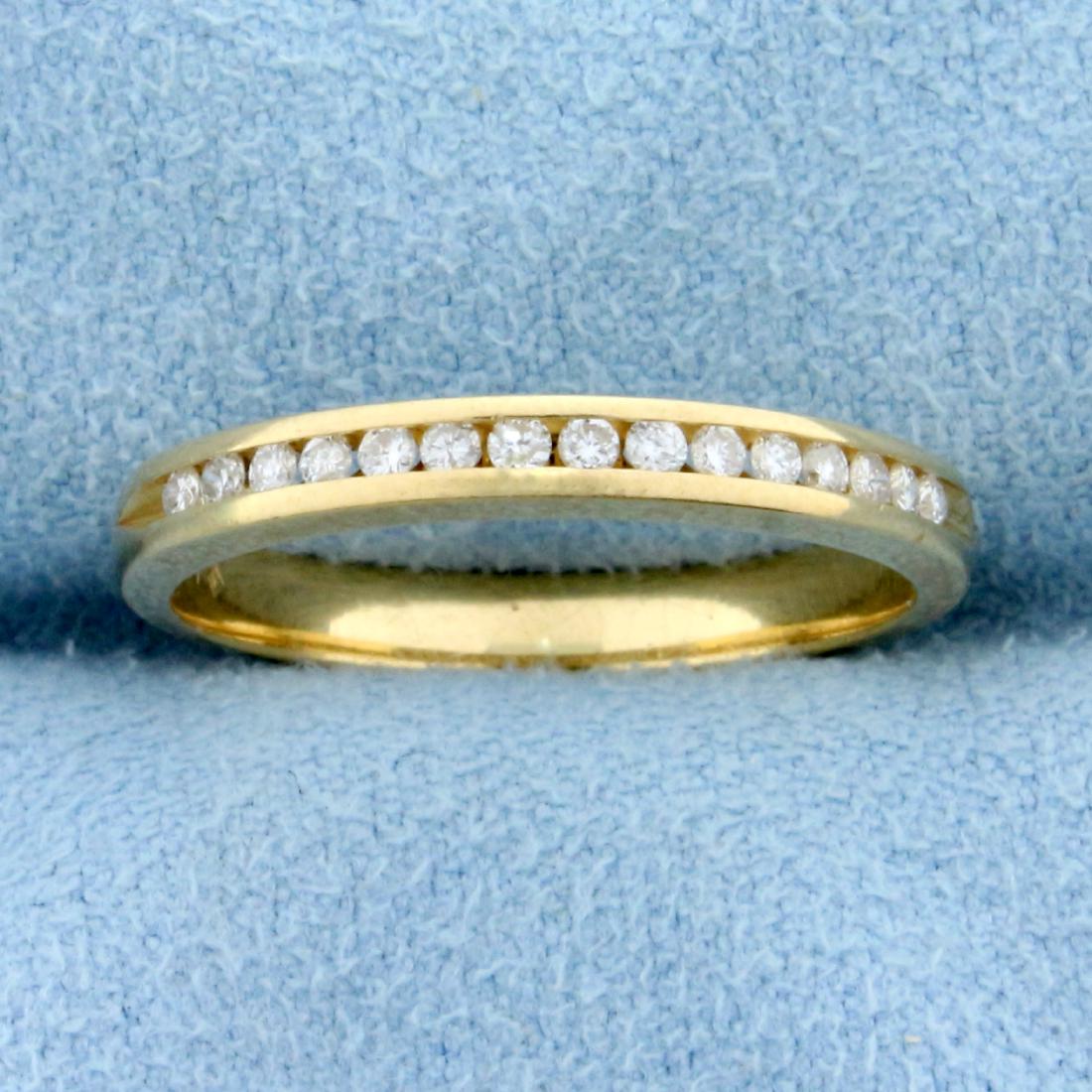 .15ct TW Channel Set Diamond Wedding Band Ring in 14K: In 14K Yellow Gold. Contains 15 high quality diamonds, .15 CTW, VS clarity/F color. 2.65mm wide. Size 6 1/2. 2.1g.