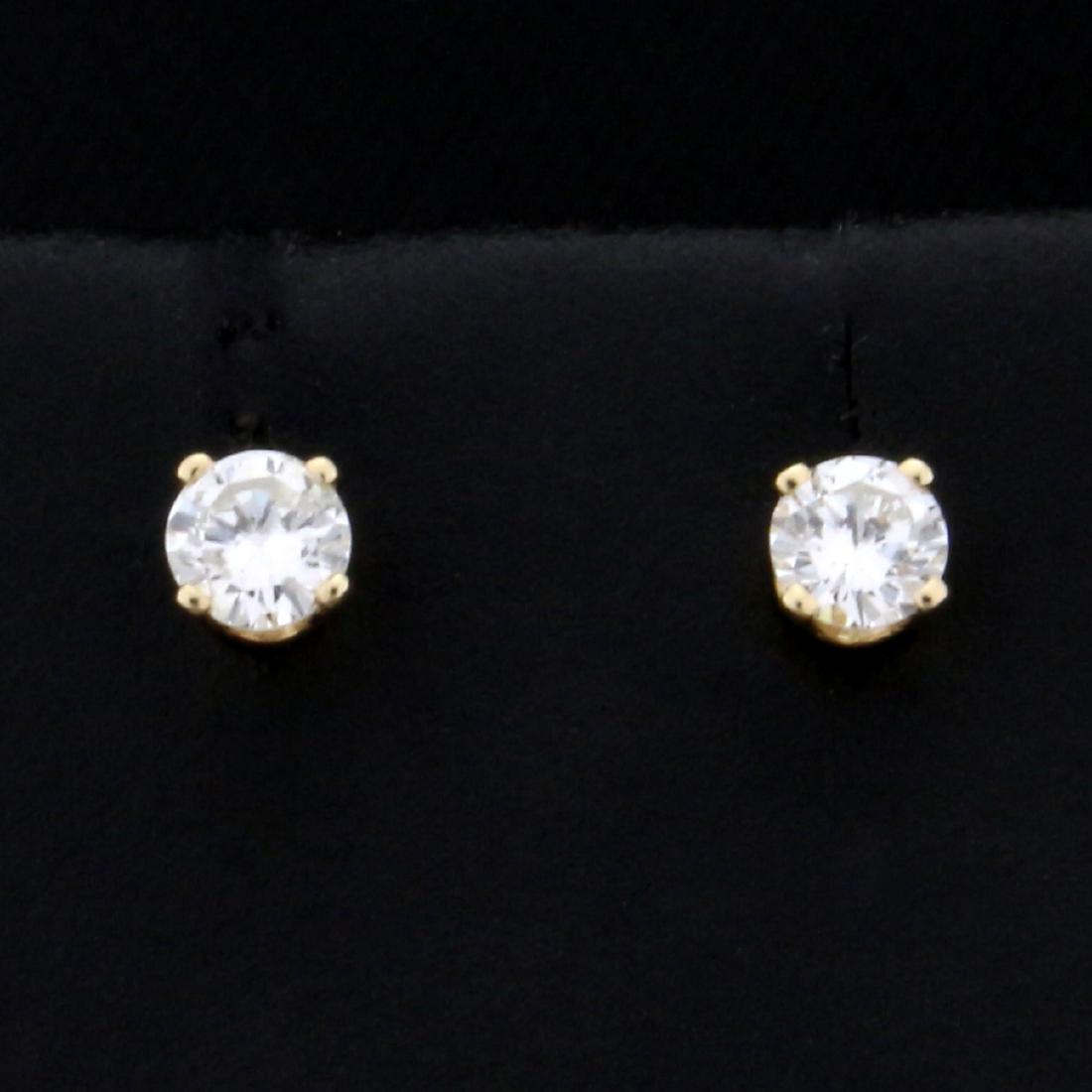 1/4ct TW Diamond Stud Earrings in 14K Yellow Gold: In 14K Yellow Gold. Contains two round brilliant Diamonds, SI1 clarity/I color and excellent cut for lot of sparkle. 0.6g.