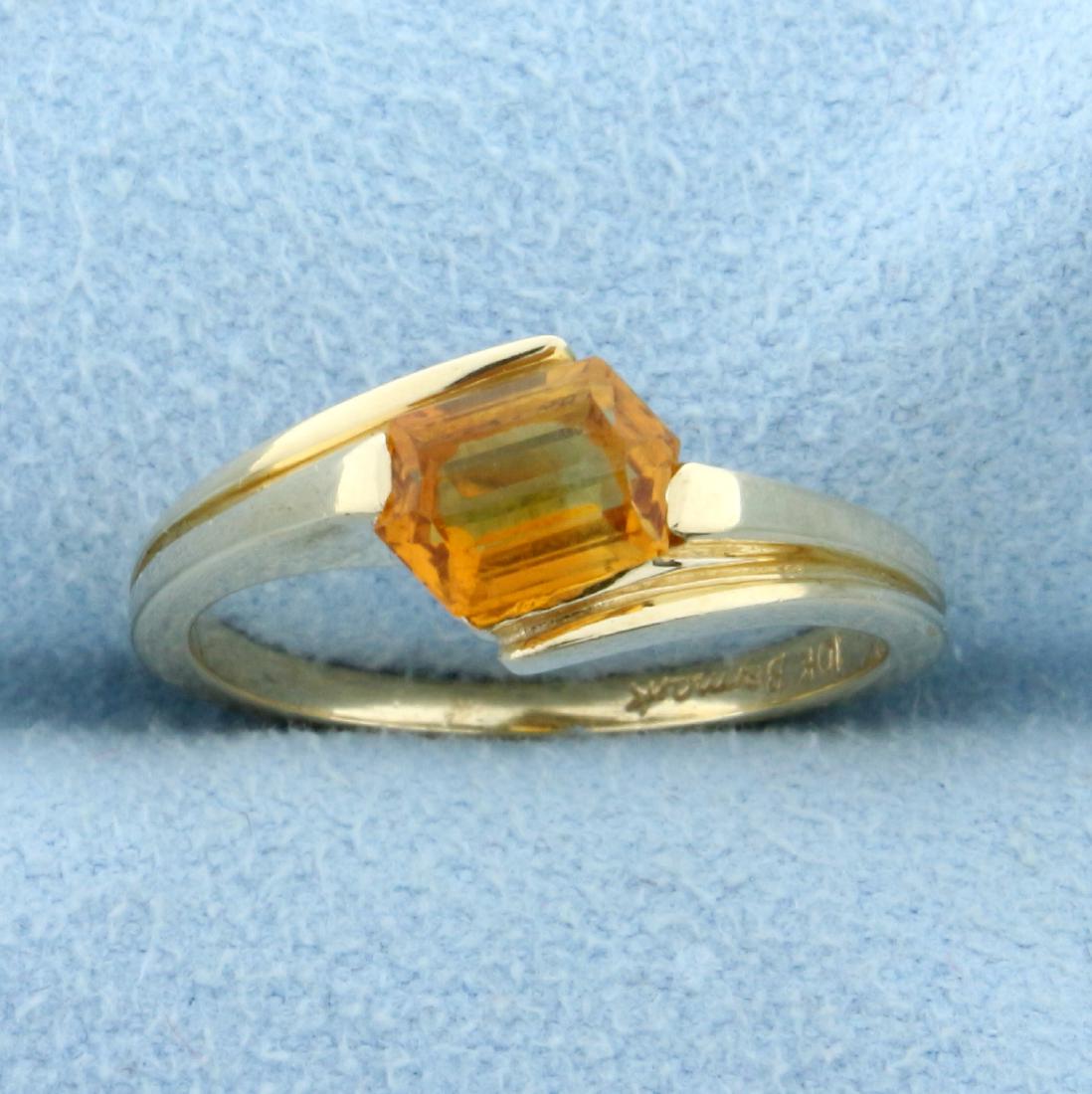 1ct Citrine Solitaire Ring in 10K Yellow Gold: In 10K Yellow Gold. Contains a high quality natural 7 x 5mm unique elongated hexagon shaped Citrine gemstone with beautiful orange yellow color and excellent clarity. Size 6. 2.5g.