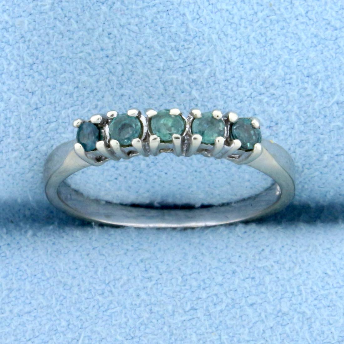 Color Changing Alexandrite Stackable Ring in 14K White: In 14K White Gold. Contains five 2.5mm Alexandrite gemstones that change from green to purple depending on light source. Size 5 1/4. 2.0g