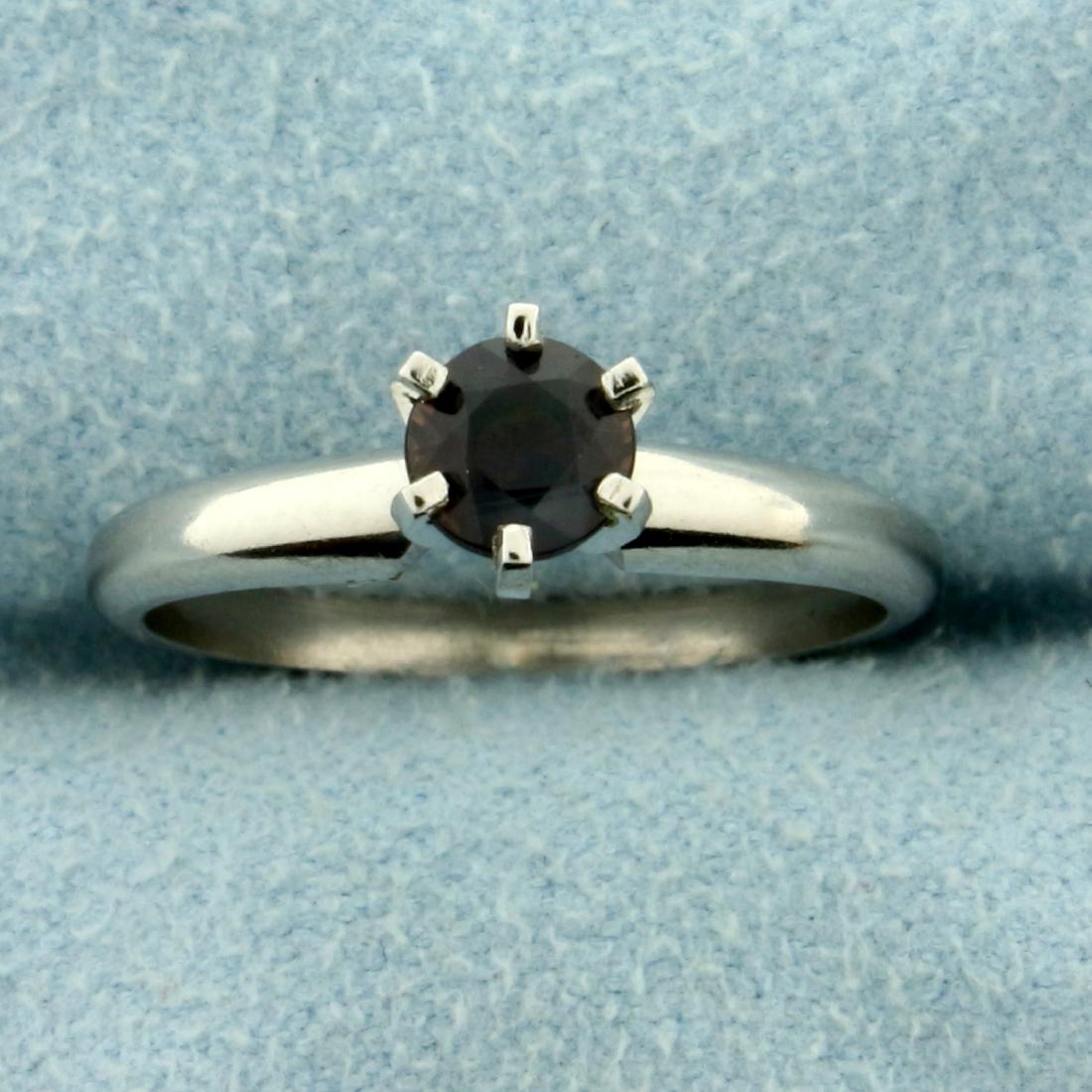 Natural Alexandrite Solitaire Ring in Platinum: In Platinum. Contains a round 4.75mm Natural Alexandrite gemstone with dramatic color change from green to red depending on light source and excellent clarity. Size 5 1/2. 3.9g