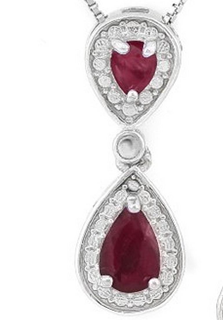 Pear Cut Ruby Dangle Drop Necklace in Sterling Silver: Contains 1-4x6mm and 2-3x4mm pear cut Ruby gemstones with beautiful ruby red color. Metal is fashioned to reflect light in a halo around gemstones. Drop measures 3/4" long. Set in platinum over .925 s