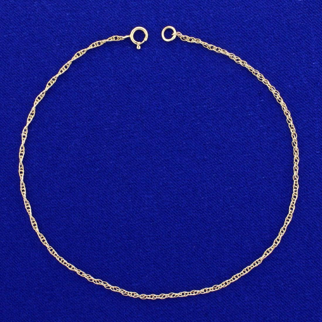9 1/2 Inch Double Cable Link Anklet in 14K Yellow Gold: In 14K Yellow Gold. 1.5mm wide. 9 1/2 inches long. 1.0g