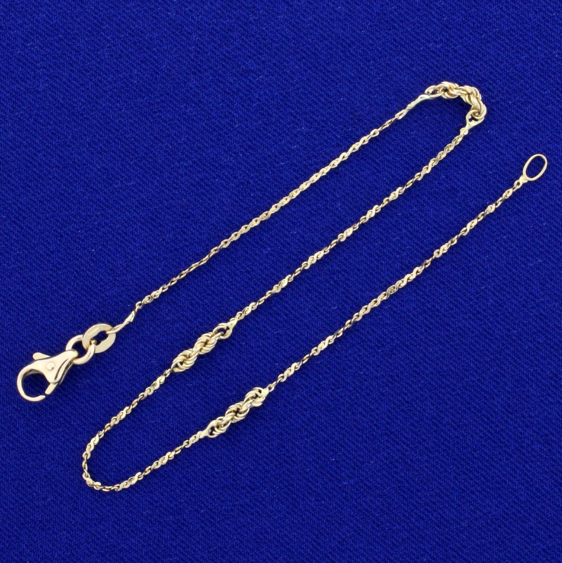 9 Inch Italian Made S-Link and Rope Style Anklet in 14K: In 14K Yellow Gold. 9 inches long with lobster clasp. 0.9mm wide. 1.7g