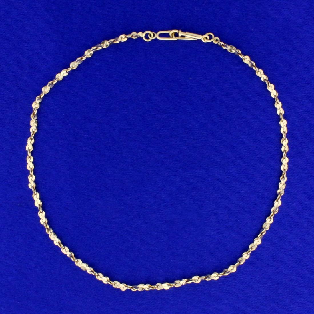 Vintage Twisting S Link Anklet in 14K Yellow Gold: In 14K Yellow Gold. 2mm wide, 9 3/4 inches long, twisting "S" link. Plunger clasp. 3.1g.