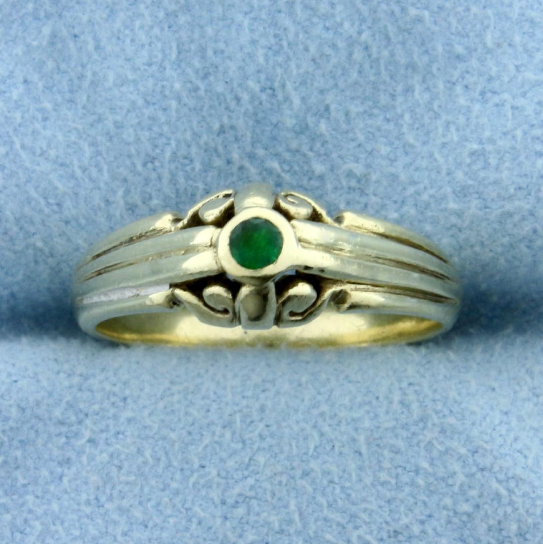 Vintage Edwardian Emerald Ring in 14K Yellow Gold: In 14K Yellow Gold. Contains one high quality natural .05ct Emerald gemstone with vibrant green color and excellent clarity. Measures 7mm wide at the top and tapers to 3mm in back. Size 6 1/2. 3.7g.