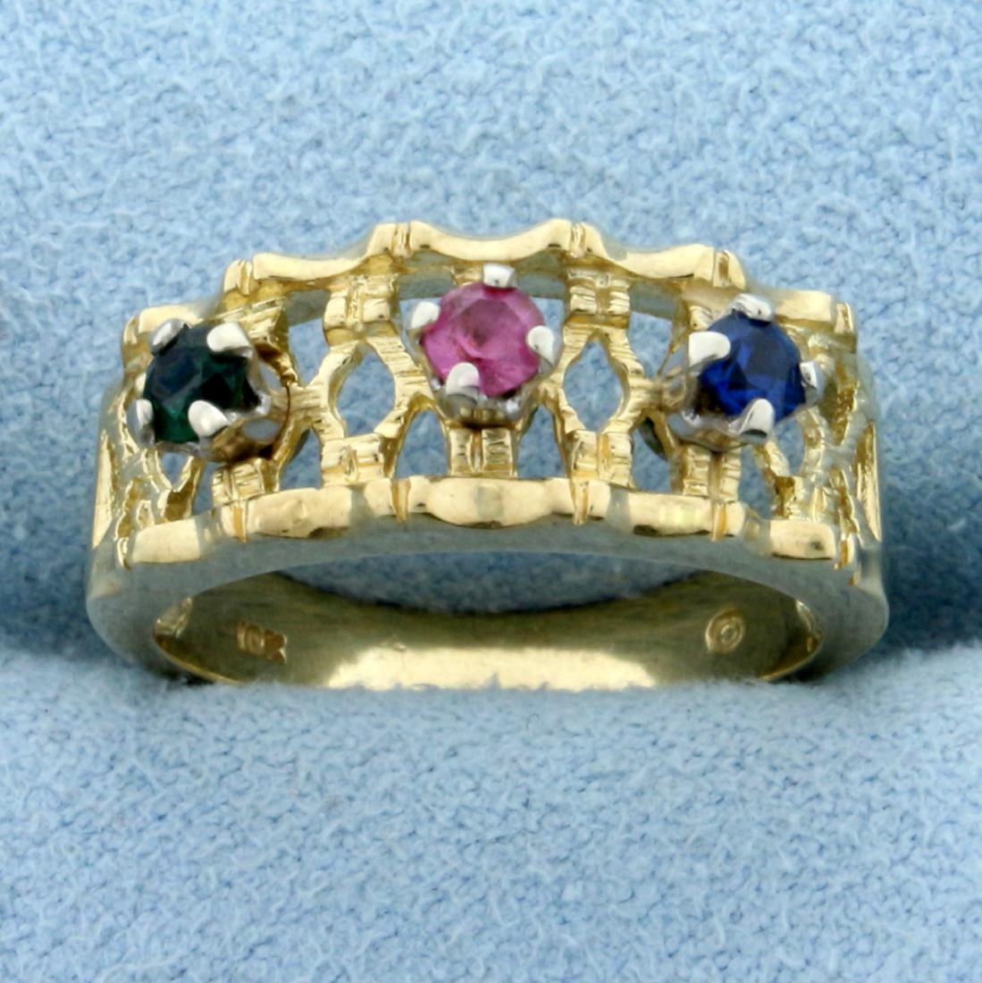 Multi-Colored Topaz Ring in 10K Yellow Gold: In 10K Yellow Gold. Contains three 3mm high quality natural topaz gemstones, one pink, one blue, and one green - all with vibrant color and excellent clarity. Size 6 1/4. 3.7g.