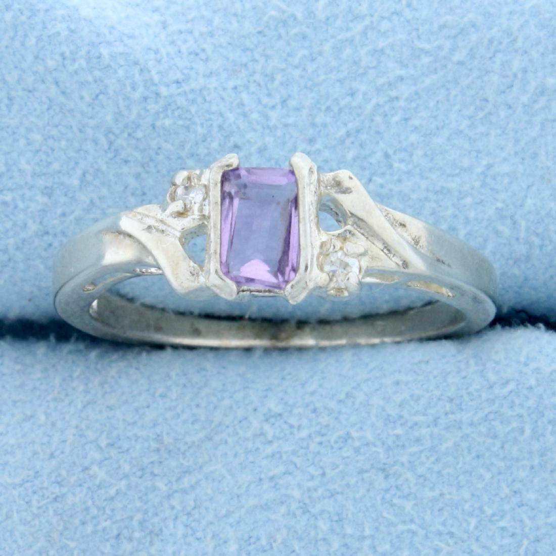 Designer Avon 1/2ct Amethyst and Diamond Ring in: In 925 Sterling Silver. Contains one high quality natural 6x4 emerald cut Amethyst gemstone with bright pastel purple color and excellent clarity. Also contains two high quality .01ct Diamonds. Size 9