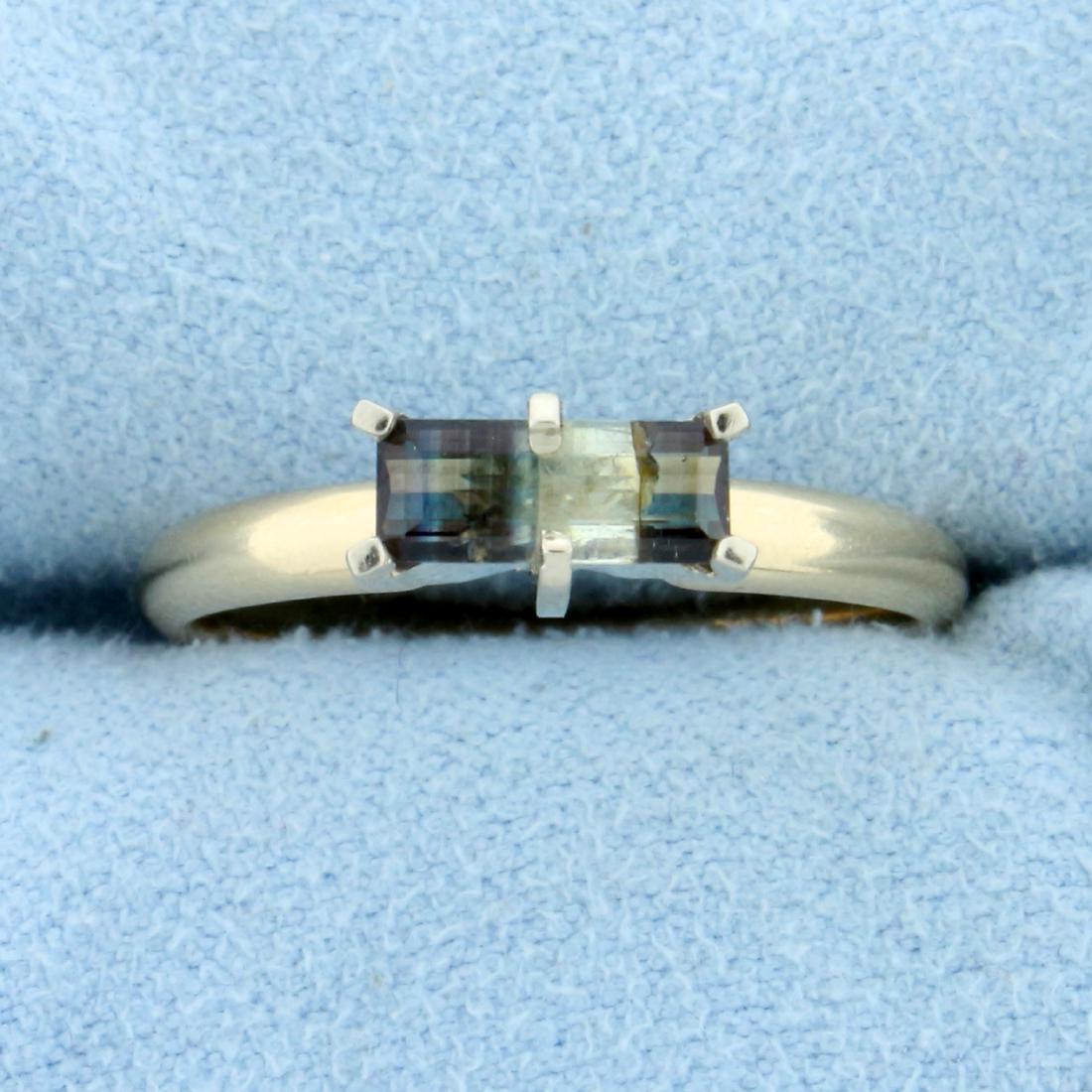 Unique Natural Color Changing Alexandrite Ring in 14K: In 14K Yellow Gold. Contains a 8 x 3.3mm high quality natural Alexandrite gemstone with banded color that changes from green to purple depending on light. Size 7 1/2. 2.7g.