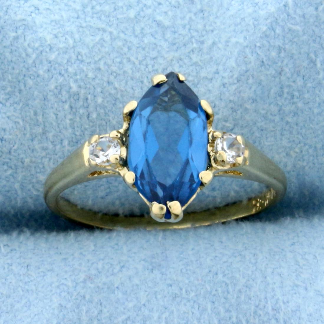 2ct Vintage Spinel and White Sapphire Ring in 10K: In 10K Yellow Gold. Contains a high quality natural 11.5x5.7mm marquise Spinel gemstone with vibrant blue color and excellent clarity. Also contains two high quality .04ct White Sapphire gemstones wit
