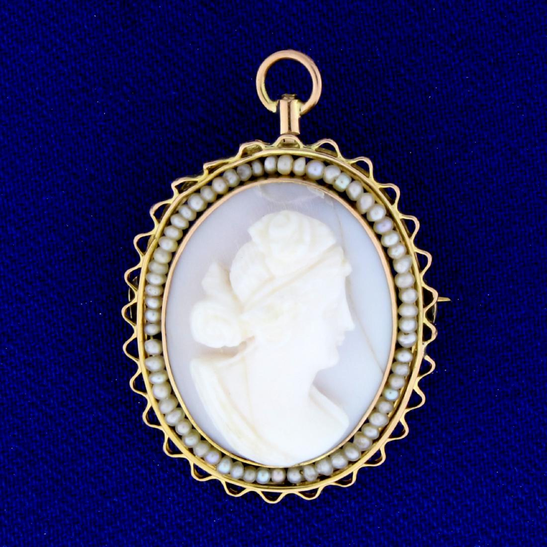 Antique Cameo Pendant or Pin with Seed Pearls in 14K: In 14K Yellow Gold. Unique white color with beautiful silver colored seed Pearls surrounding cameo. Small crack in cameo as seen on picture. 1 1/4 inches long with bale extended. Bale retracts when wo