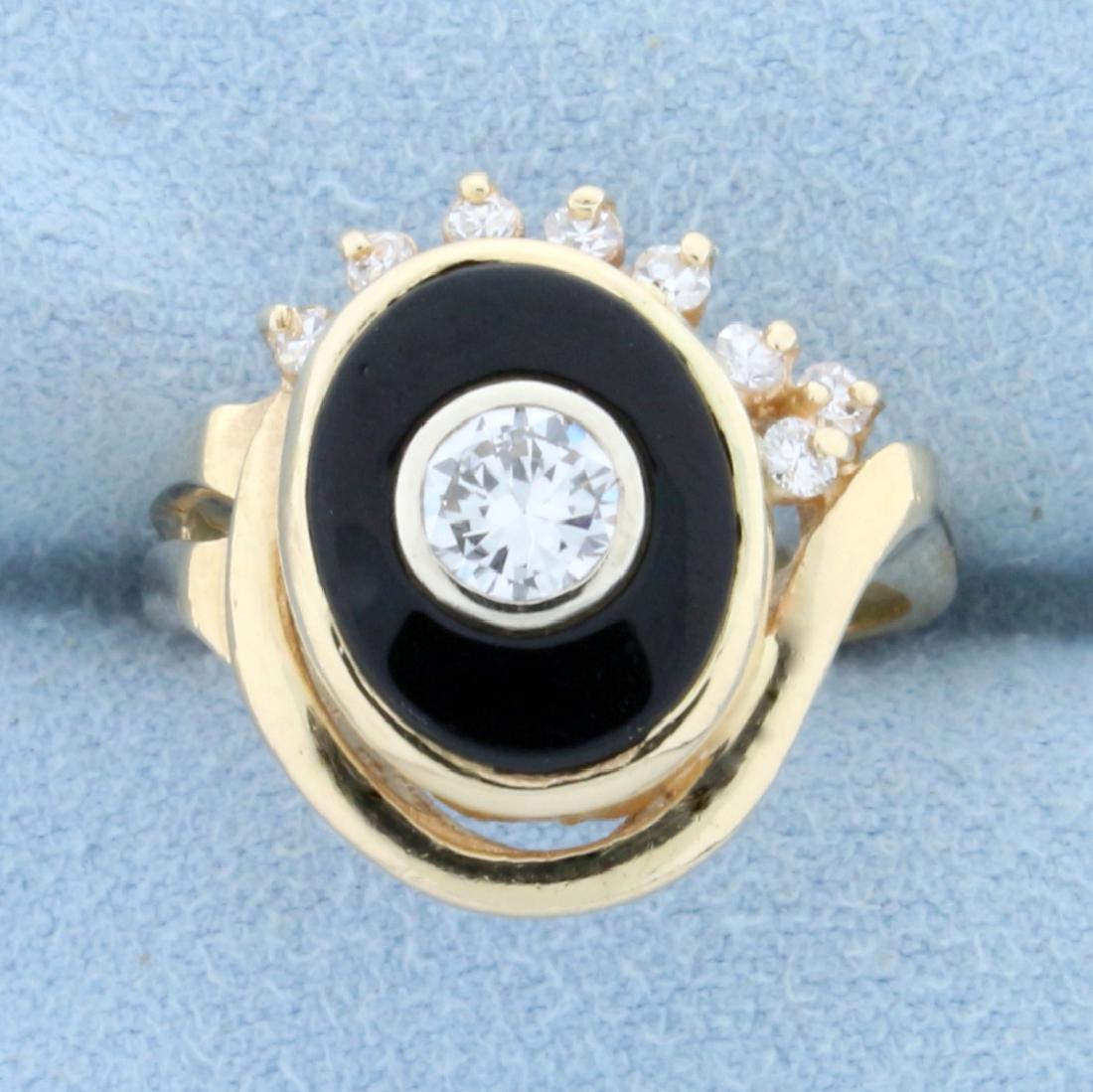 Vintage 3/4ct TW Diamond and Onyx Evil Eye Ring in 14K: In 14K Yellow Gold. Contains one high quality 1/2ct Diamond, VS clarity/ H color. Also contains eight high quality Diamonds, .25ct TW, of similar high quality. Onyx measures 12 x 10mm. Size 7. 6.7g.