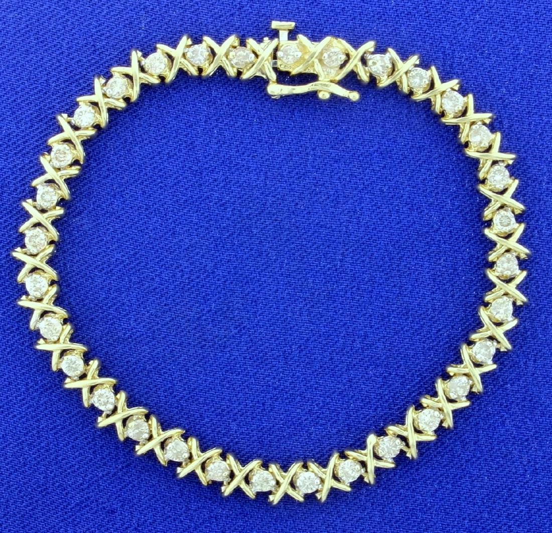 2ct TW Diamond Tennis Bracelet in 14k Yellow Gold: In 14K yellow gold, the bracelet contains thirty two high quality .06ct round diamonds, I color/I clarity. It is 7 1/4 inches long and 5.8mm wide, with a safety clasp. 11.0g