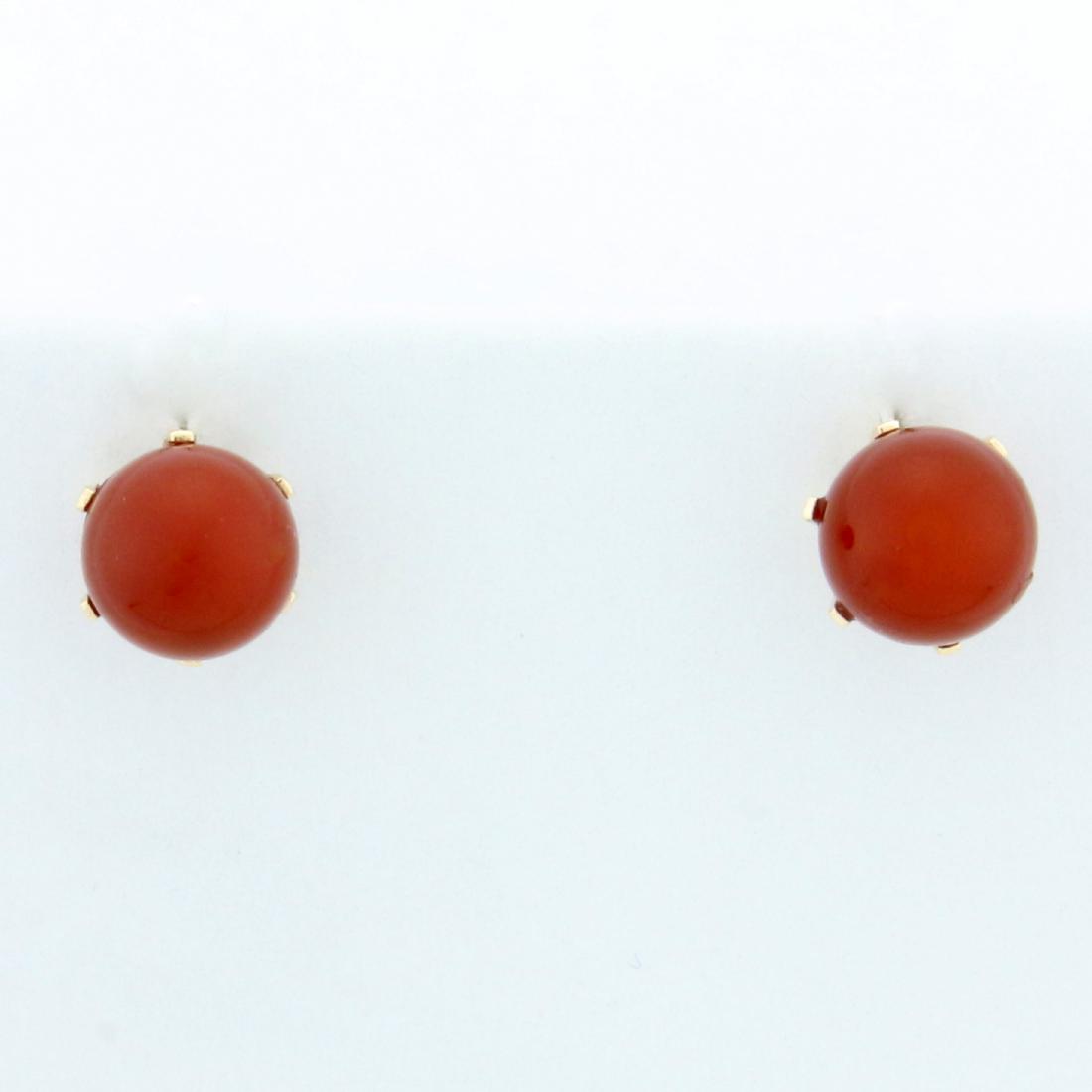 6mm Carnelian Ball Stud Earrings in 10K Yellow Gold: In 10K Yellow Gold. 6mm red carnelian gemstones with bright color and excellent clarity. Gold plated earring backs included. 1.1g.