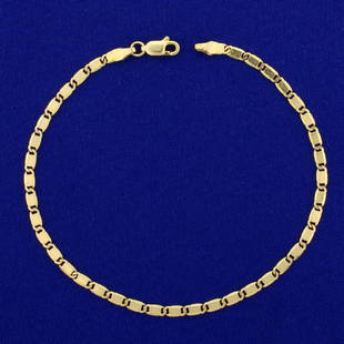 Italian-Made 9 Inch Diamond Cut Designer Link Anklet in: In 14K Yellow Gold. 9 inches long. 2.86mm wide. Lobster clasp. 4.8g