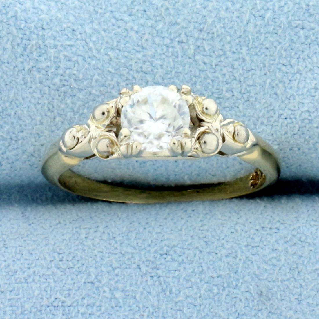 Antique 1/2ct White Sapphire Solitaire Ring in 14K: In 14k White and Yellow Gold. Contains a high quality 1/2ct White Sapphire Gemstones with excellent clarity and lots of sparkle. Size 6. 2.4g.