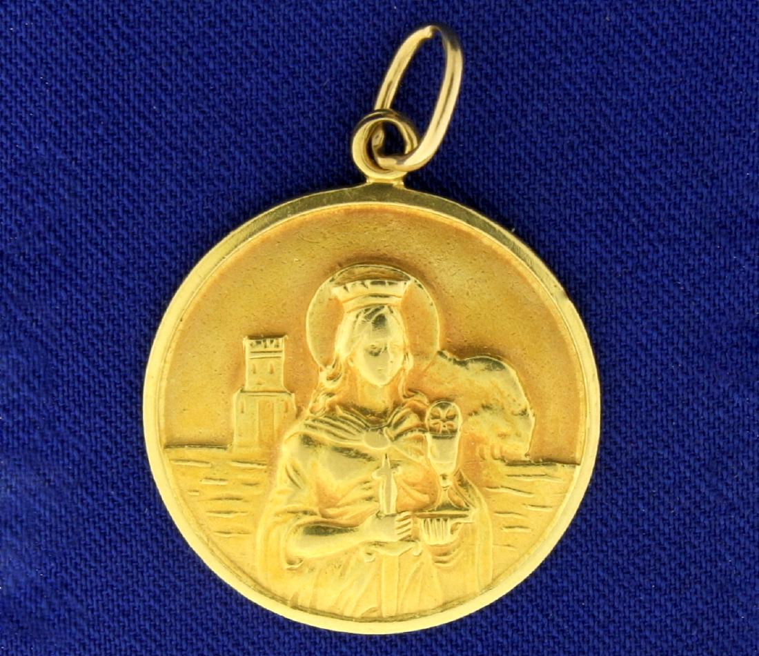Saint Barbara Pendant in 18k Gold: In 18k yellow gold, 1 3/8 inch long with bale. Saint Barbara, a Virgin Martyr, is the patron saint of firefighters, soldiers, prisoners, stone masons, those who have dangerous professions, constructio