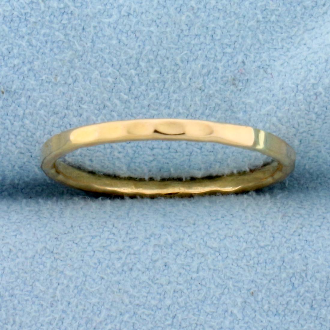 1.6mm Hammered Edge Stacking Band Ring in 18K Rose Gold: In 18K Rose Gold. 1.6mm wide. Size 7. 1.5g