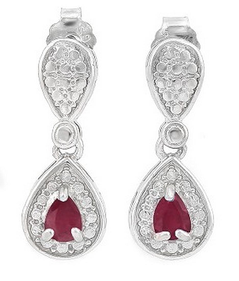 Pear Cut Ruby Dangle Earrings in Sterling Silver: Contains 2-3x4mm pear cut Ruby gemstones with beautiful ruby red color. Metal is fashioned to reflect light in a halo around gemstones. Dangle measures 5/8" long. Set in platinum over .925 sterling si
