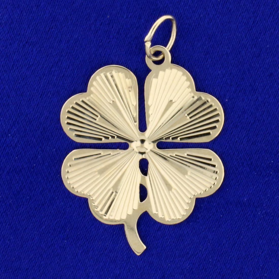 Four-Leaf Clover Pendant in 14K Yellow Gold: In 14K Yellow Gold. 1 1/2 inches long with bale. 3.1g
