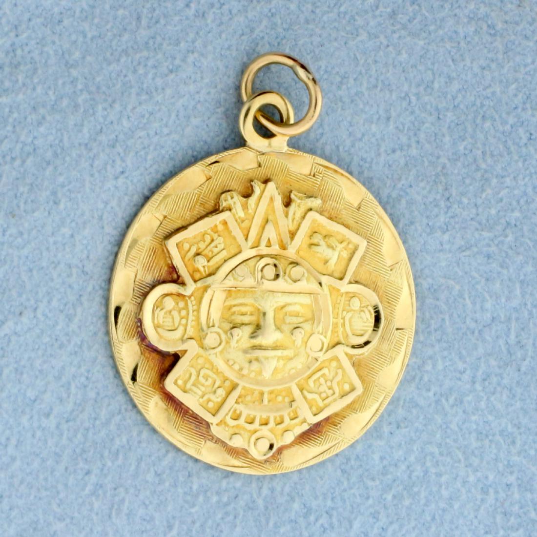 Aztec Sun God Pendant or Charm in 14K Yellow Gold: In 14K Yellow Gold. 1 1/4 inch long with jump ring. 7.3g