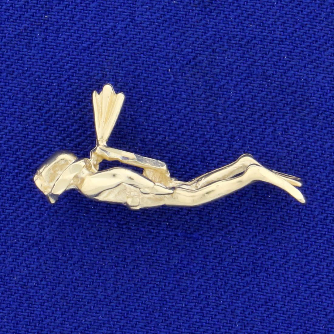 3-D Scuba Diver Charm or Pendant in 14K Yellow Gold: In 14K Yellow Gold. 1 inch wide. 2.6g.