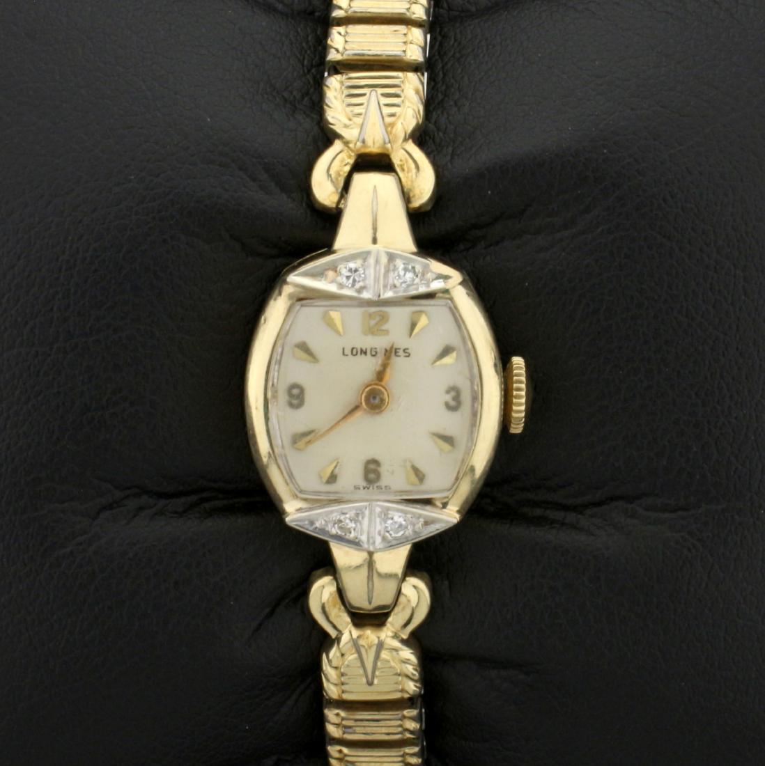 Antique Longines Diamond Windup Wristwatch: 10K Yellow Gold Filled case. Contains four high quality .01ct round cut Diamonds. 6.5mm Speidel band. Windup movement runs great. 16.6g