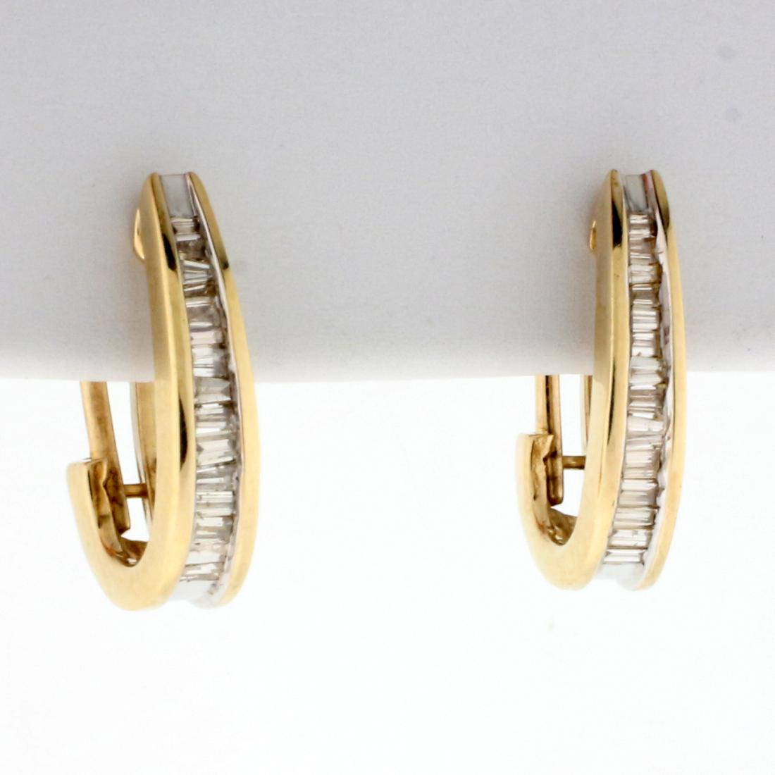 1/2ct TW Baguette Diamond Hoop Earrings in 10K Yellow: In 10K Yellow Gold. Each earring contains fifteen high quality baguette diamonds, SI clarity/H color. 5/8 inch long, approximately 3.8mm wide. French omega backs for pierced ears. 4.2g.